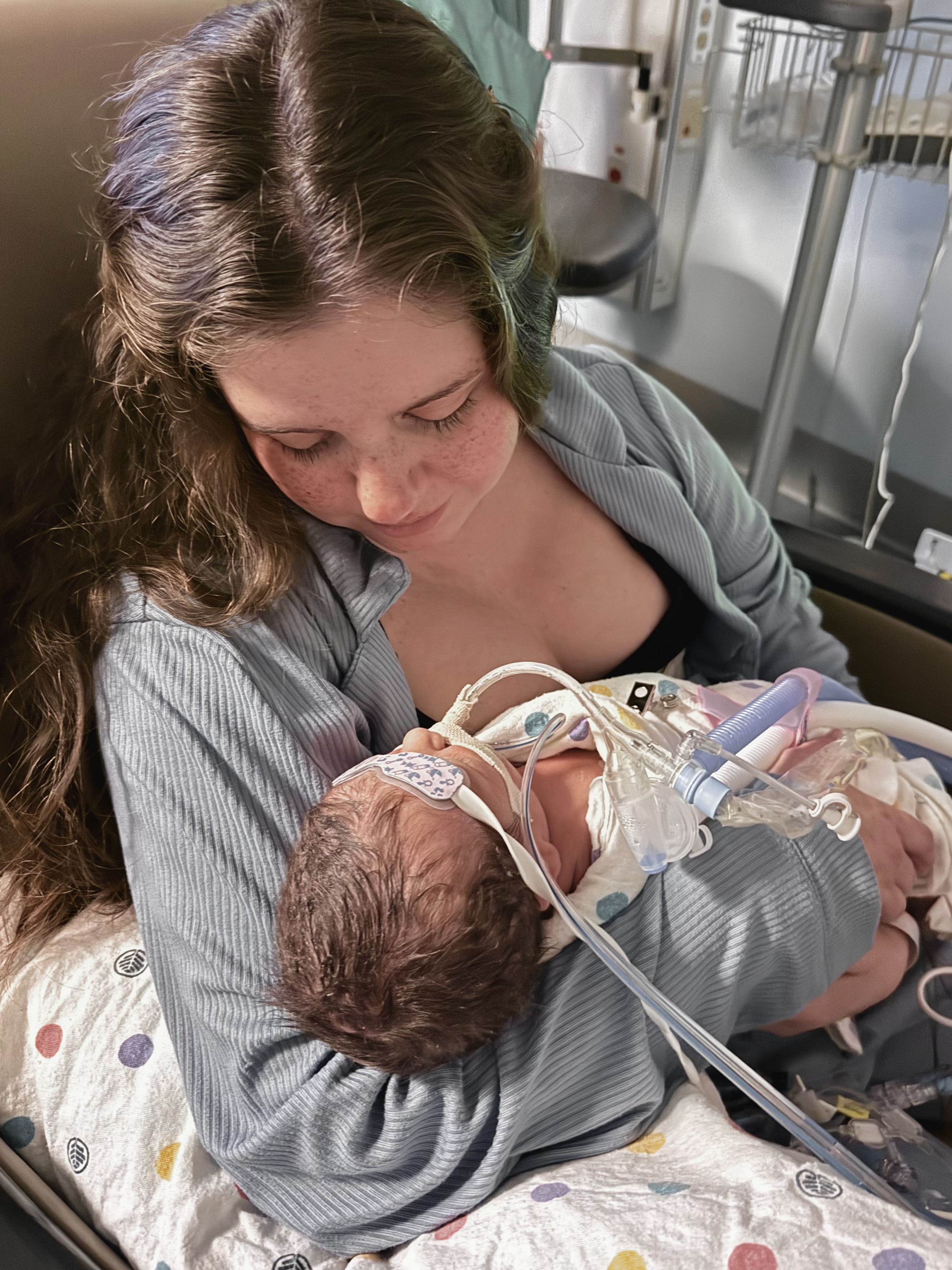 Adriana holding Samuel in the NICU