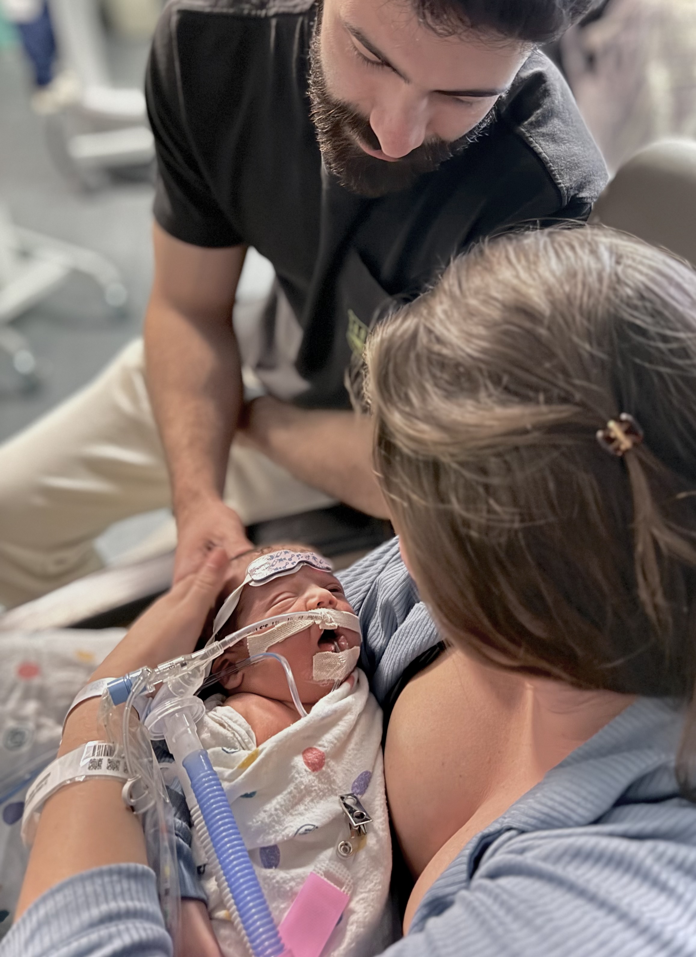 Samuel yawning with mom and dad