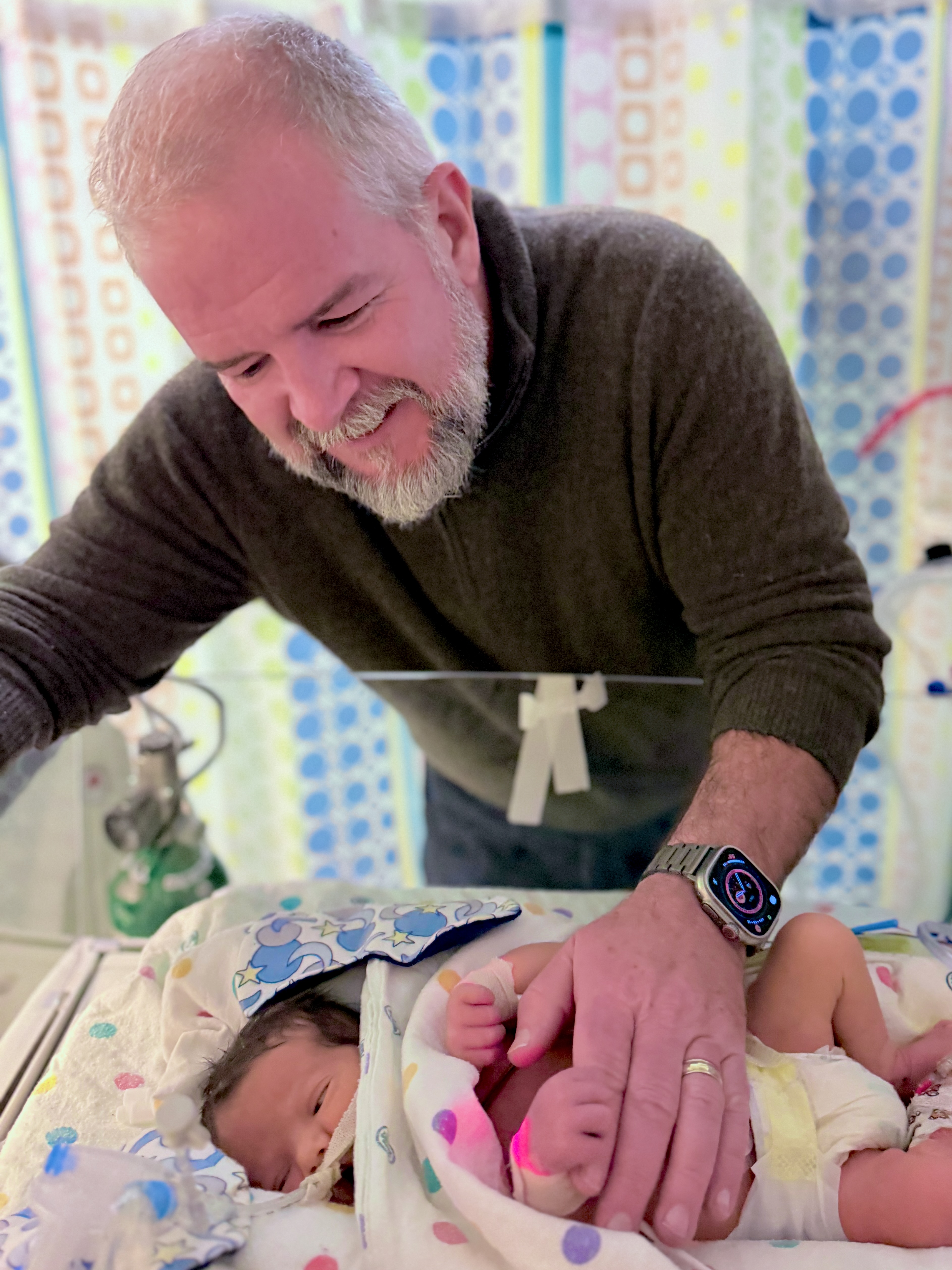 Grandpa with Samuel in the NICU